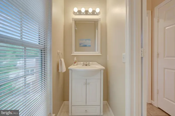 a bed room with a bed and a large window