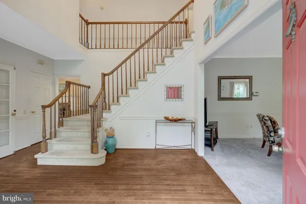a spacious bedroom with a bed and a book shelf