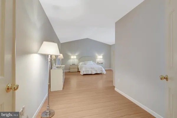 a view of balcony with wooden floor and fence