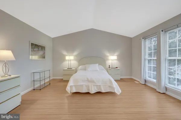 a view of front door of house and wooden deck
