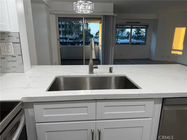 a kitchen with a sink and a window