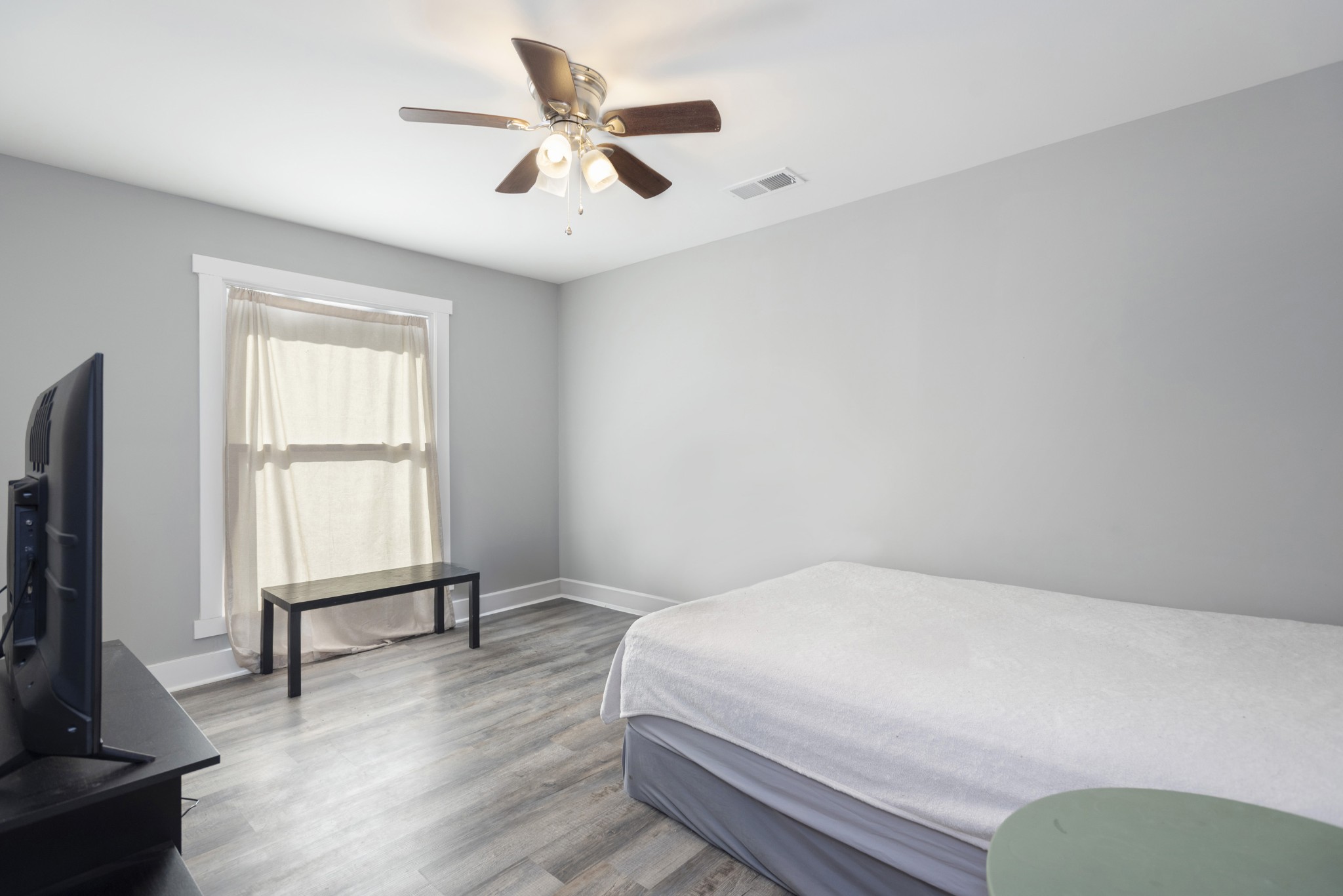108 Esque Road Bethpage, TN 37022 - Photo 16 of 30 a bedroom with a bed and a flat screen tv