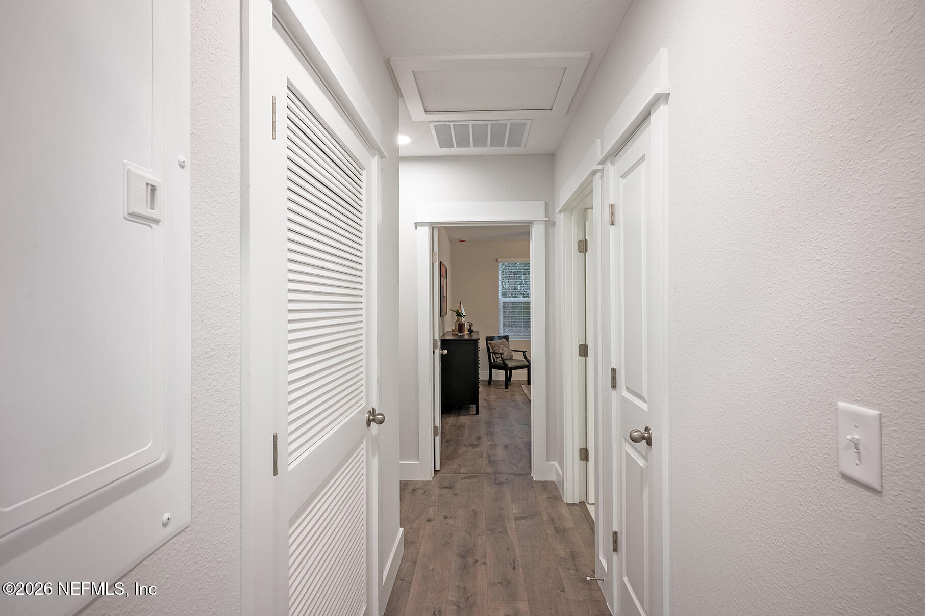 2743 Chelton Road Jacksonville, FL 32216 - Photo 11 of 51 a view of a hallway with closet and wooden floor
