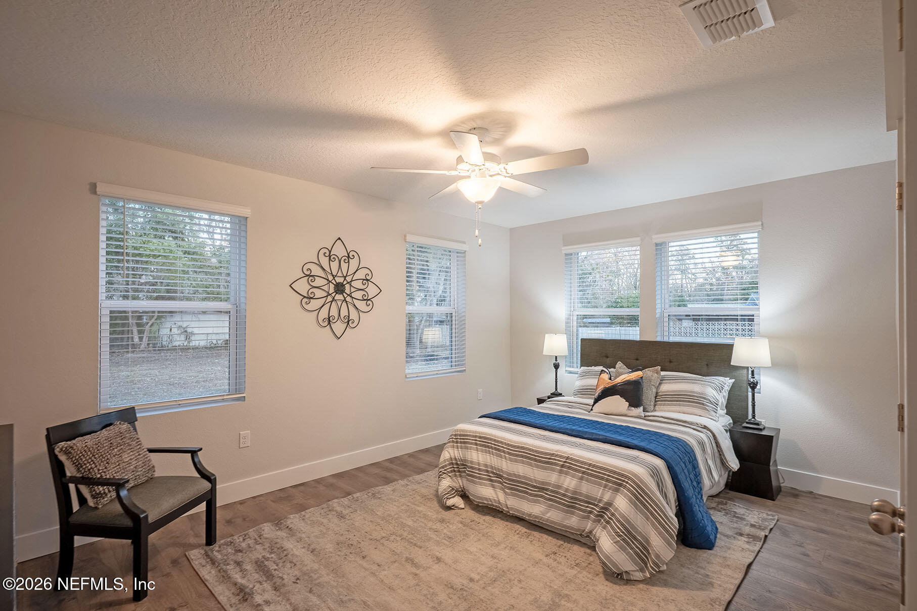 2743 Chelton Road Jacksonville, FL 32216 - Photo 15 of 51 a bedroom with a bed and a window