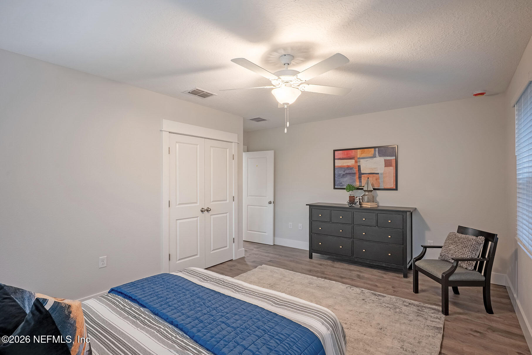 2743 Chelton Road Jacksonville, FL 32216 - Photo 17 of 51 a bedroom with a bed and a dresser