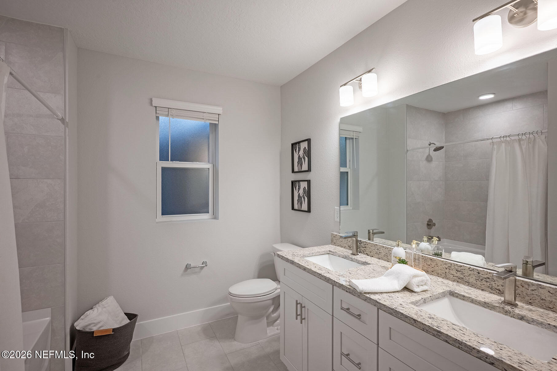 2743 Chelton Road Jacksonville, FL 32216 - Photo 20 of 51 a bathroom with a granite countertop sink a toilet and mirror