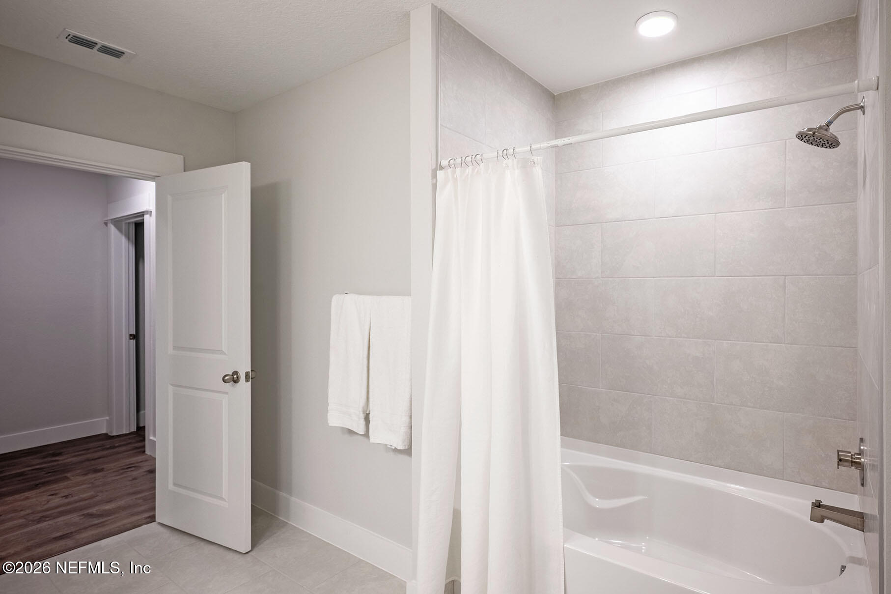 2743 Chelton Road Jacksonville, FL 32216 - Photo 21 of 51 a bathroom with a bathtub and a shower