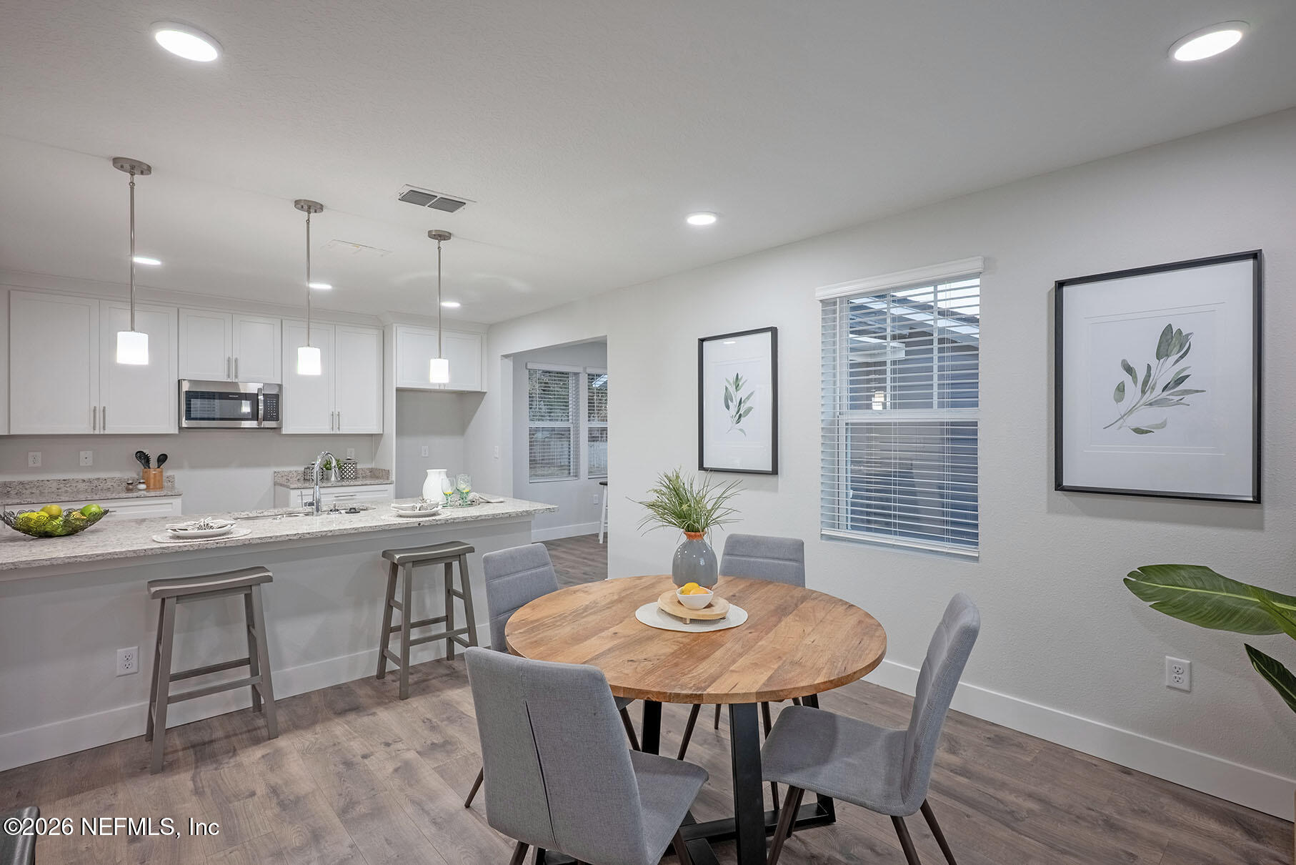2743 Chelton Road Jacksonville, FL 32216 - Photo 27 of 51 a view of a dining room with furniture window and wooden floor
