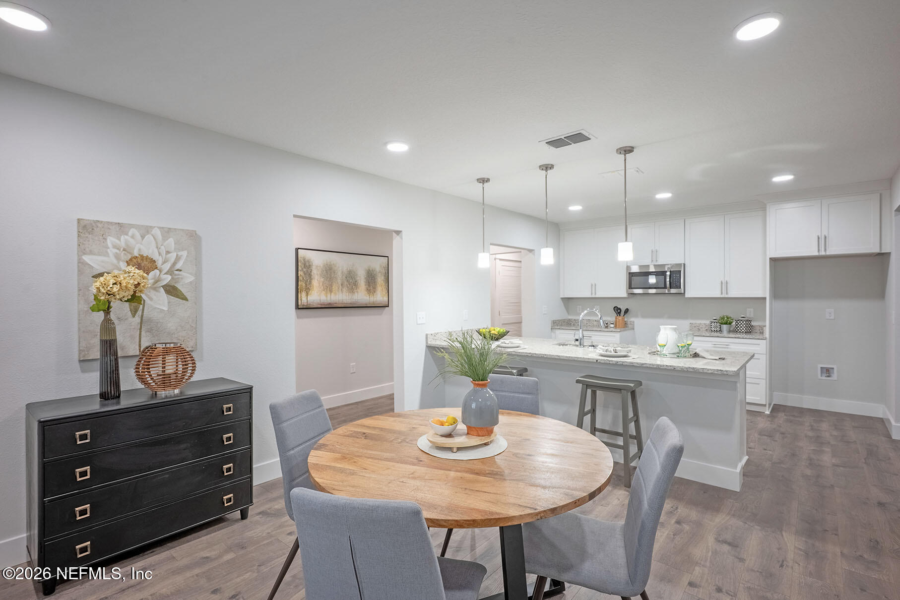 2743 Chelton Road Jacksonville, FL 32216 - Photo 28 of 51 a view of a dining room with furniture and wooden floor