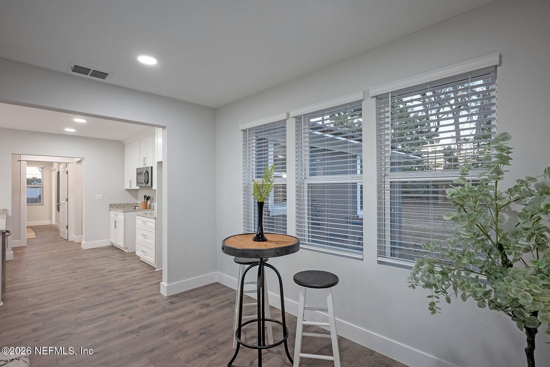 2743 Chelton Road Jacksonville, FL 32216 - Photo 35 of 51 a view of a livingroom with furniture wooden floor and a window