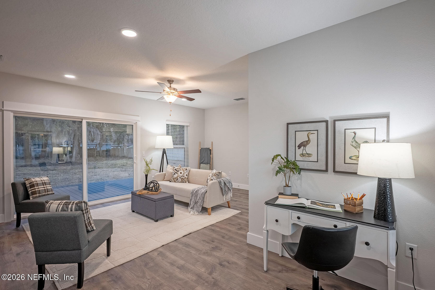 2743 Chelton Road Jacksonville, FL 32216 - Photo 37 of 51 a living room with furniture and a lamp