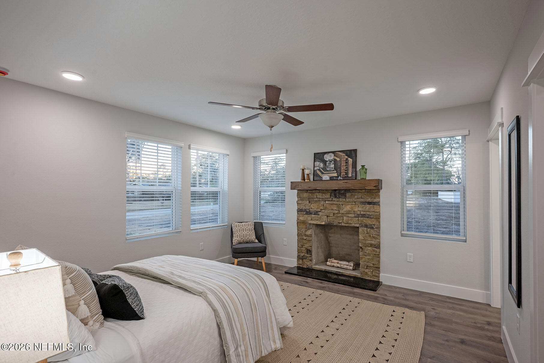 2743 Chelton Road Jacksonville, FL 32216 - Photo 4 of 51 a bedroom with a bed and a fireplace