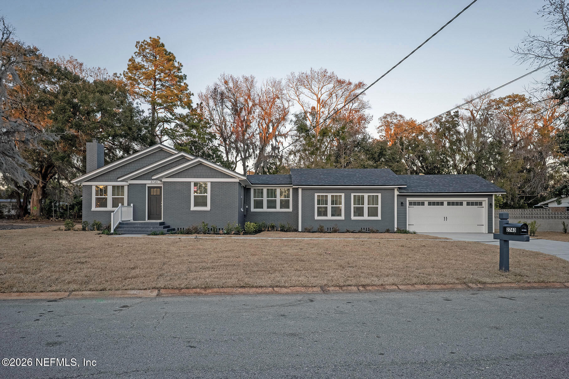 2743 Chelton Road Jacksonville, FL 32216 - Photo 51 of 51 a front view of a house with a yard