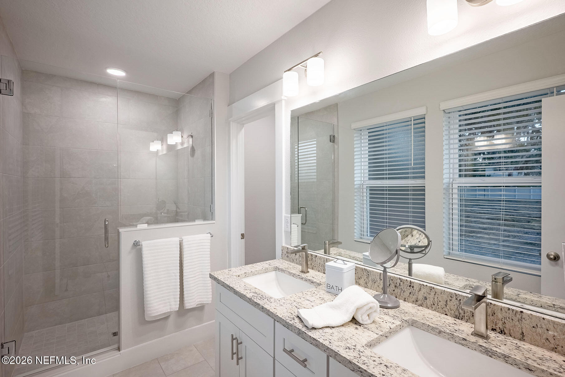 2743 Chelton Road Jacksonville, FL 32216 - Photo 9 of 51 a bathroom with double vanity sinks and a mirror