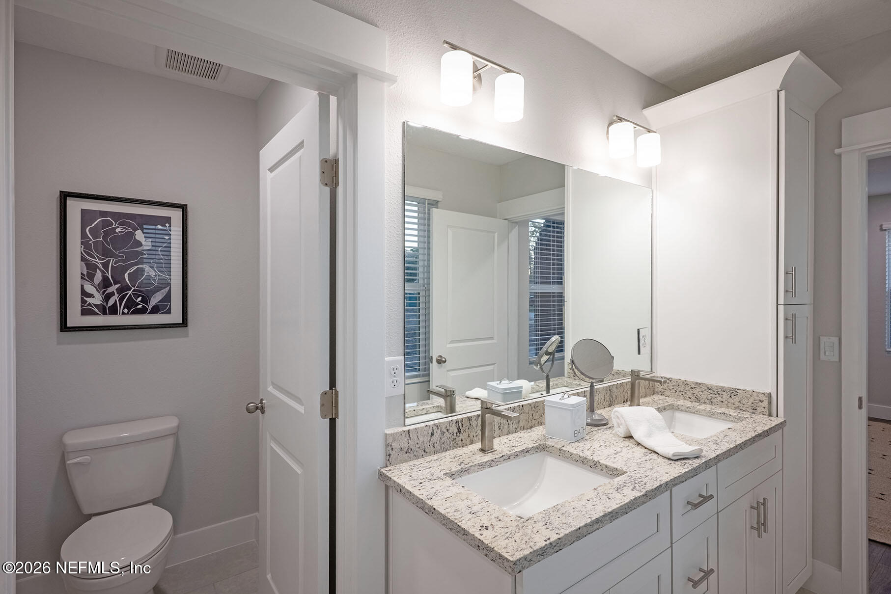 2743 Chelton Road Jacksonville, FL 32216 - Photo 10 of 51 a bathroom with a granite countertop sink and a mirror with toilet