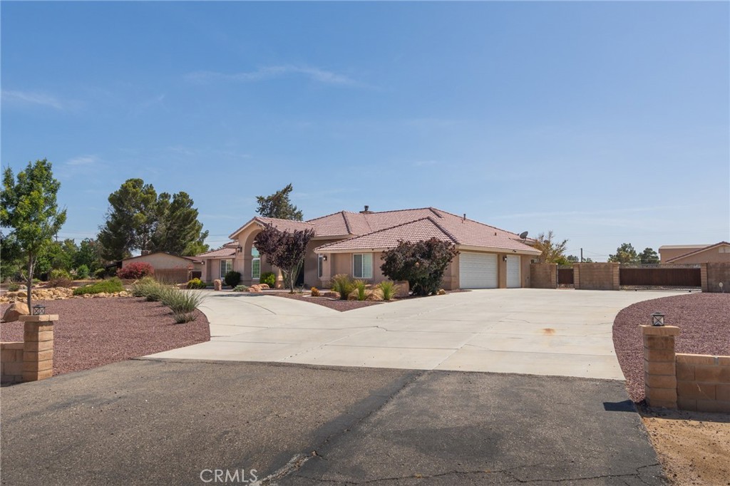 19501 Kinai Road Apple Valley, CA 92307 - Photo 2 of 49 a row of car parked in front of house