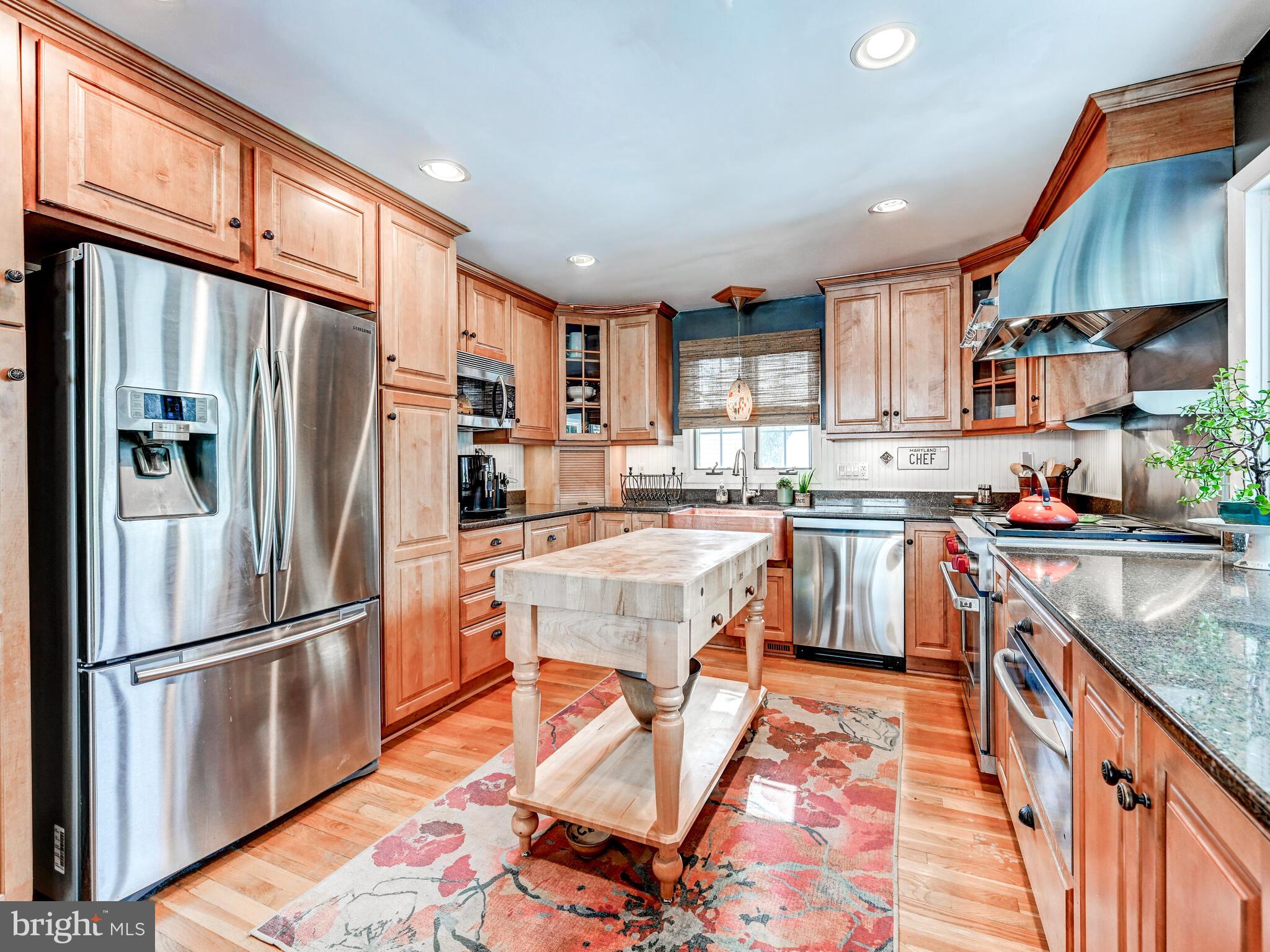 201 Brightdale Road Lutherville-Timonium, MD 21093 - Photo 16 of 48 a kitchen with stainless steel appliances granite countertop a refrigerator oven a sink dishwasher and cabinets with wooden floor