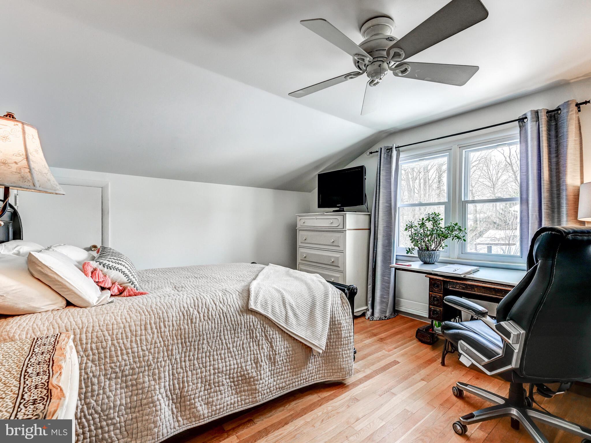 201 Brightdale Road Lutherville-Timonium, MD 21093 - Photo 25 of 48 a bedroom with a bed and a chandelier