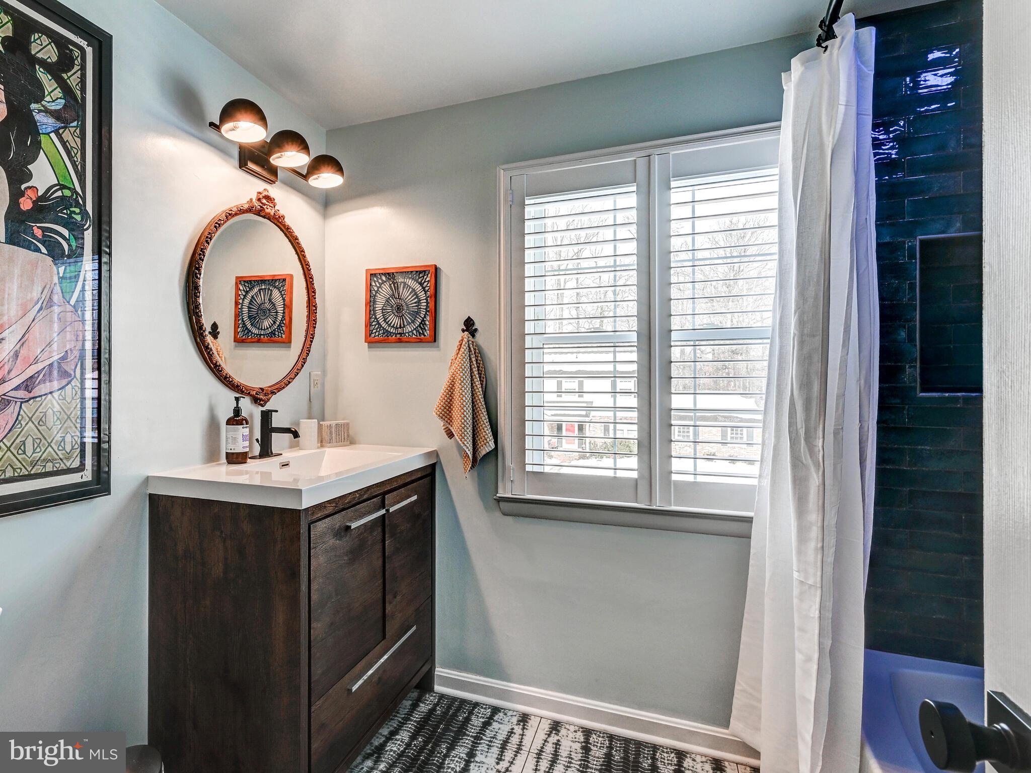 201 Brightdale Road Lutherville-Timonium, MD 21093 - Photo 28 of 48 a bathroom with a sink and a mirror