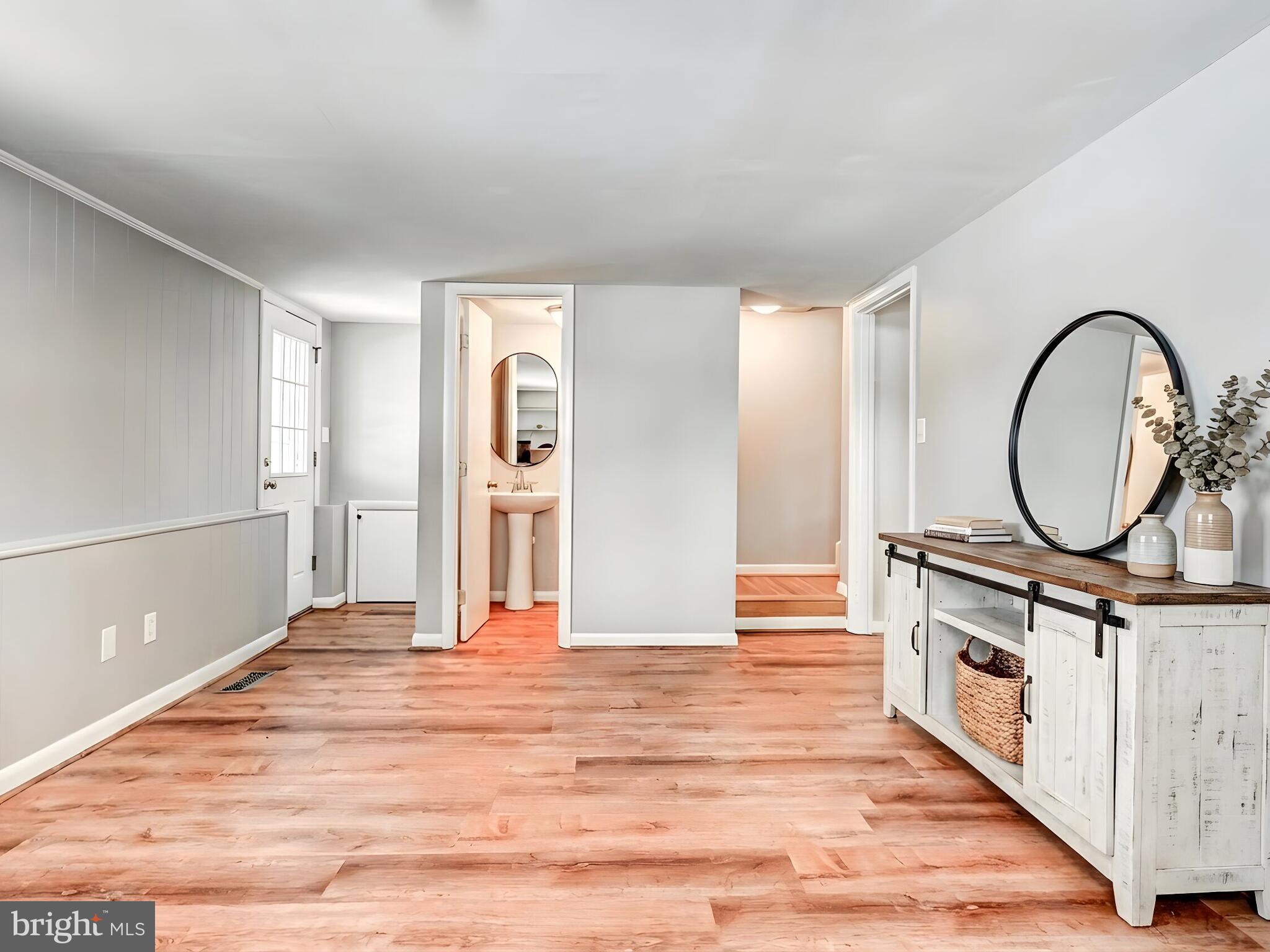 201 Brightdale Road Lutherville-Timonium, MD 21093 - Photo 30 of 48 a view of a room with wooden floor and white walls