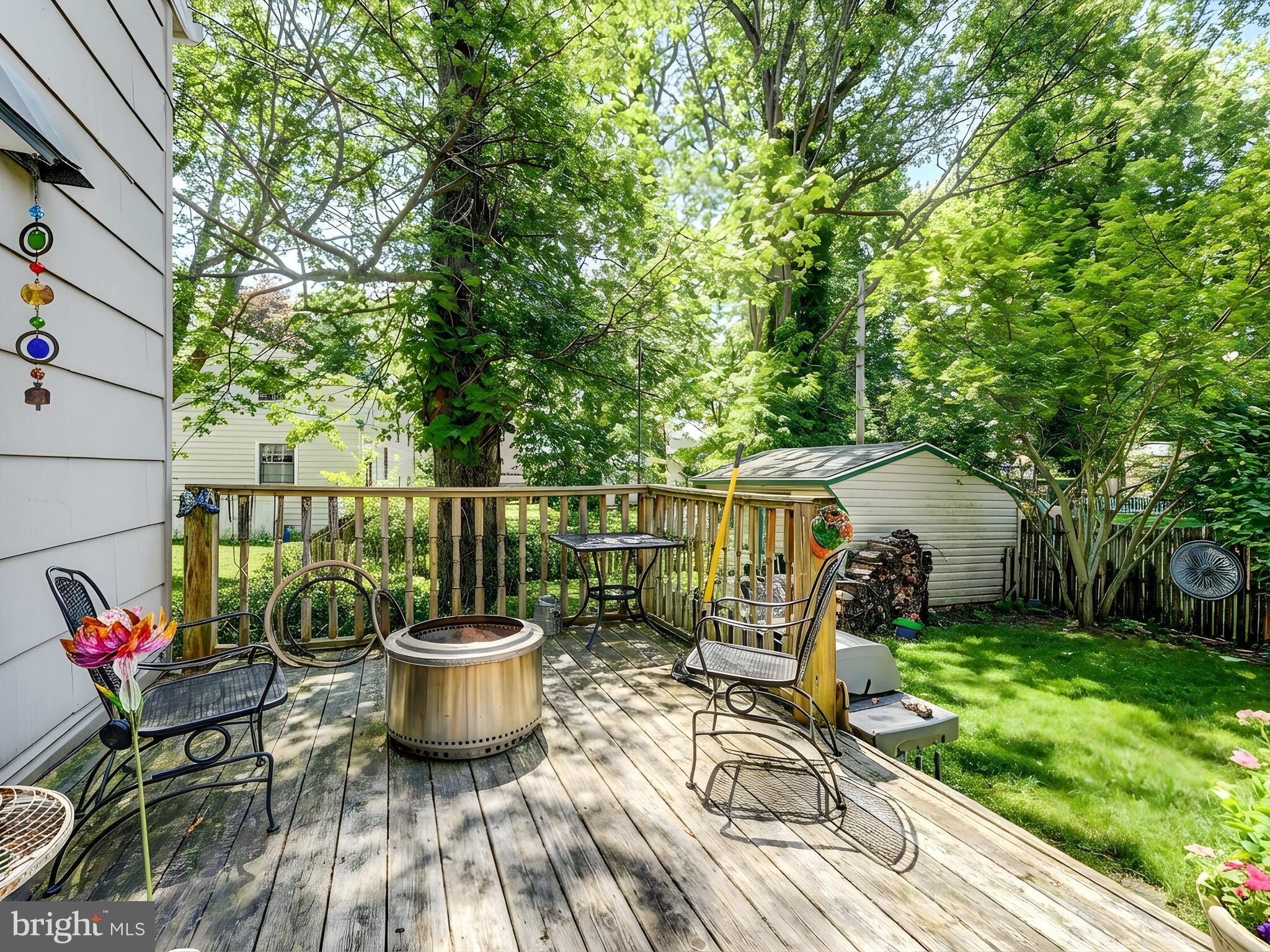 201 Brightdale Road Lutherville-Timonium, MD 21093 - Photo 33 of 48 a view of a patio with chair and chairs potted plants and large tree