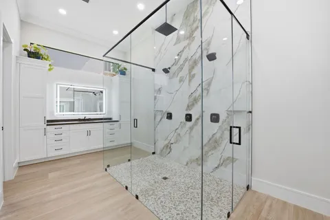 a bathroom with a double vanity sink and a mirror