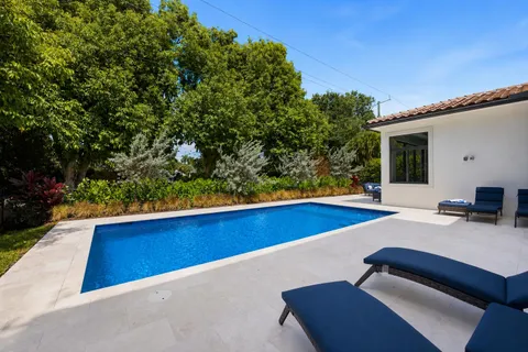 a view of backyard with seating space