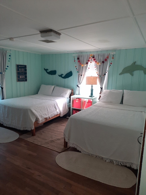 77 Gurnet Road, Unit 77 Duxbury, MA 02332 - Photo 11 of 15 a bedroom with two beds and a table