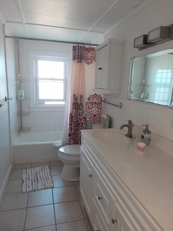 77 Gurnet Road, Unit 77 Duxbury, MA 02332 - Photo 12 of 15 a bathroom with a sink a toilet and shower