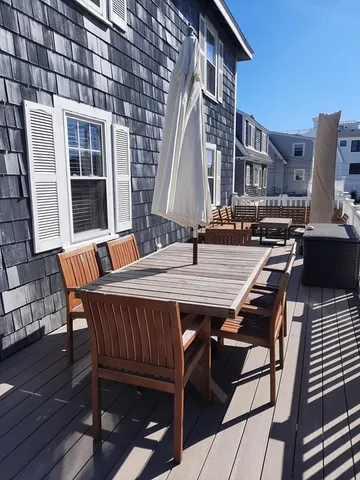 a patio with table and chairs