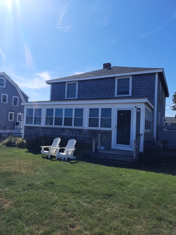 77 Gurnet Road, Unit 77 Duxbury, MA 02332 - Photo 6 of 15 a front view of a house with a yard