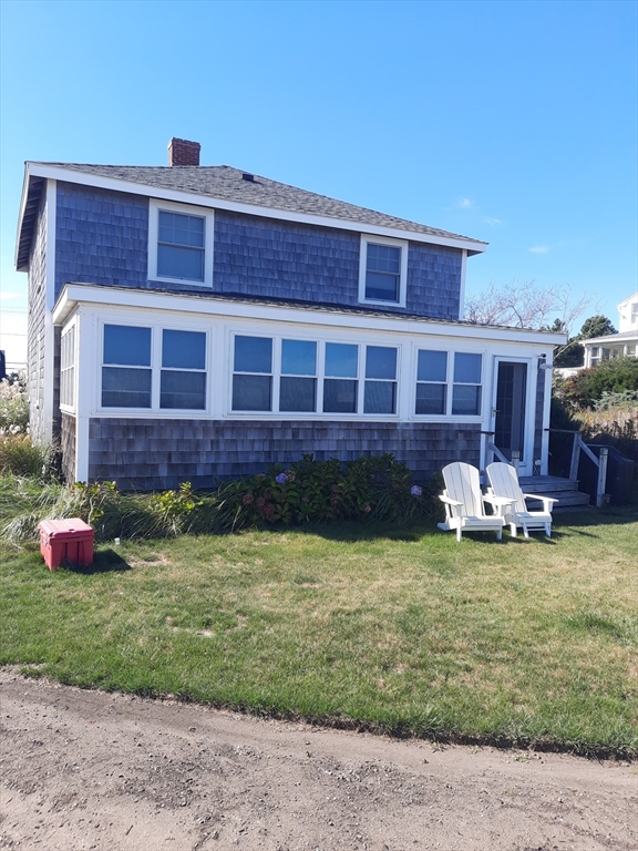 77 Gurnet Road, Unit 77 Duxbury, MA 02332 - Photo 7 of 15 a view of a house with a yard