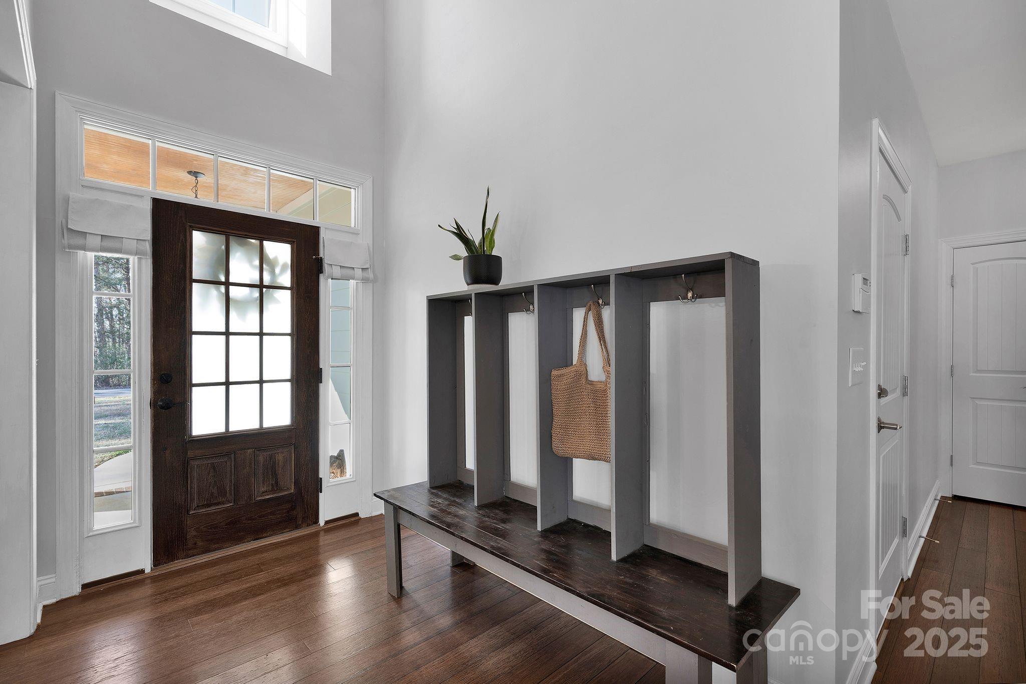 481 Evergreen Road Lake Wylie, SC 29710 - Photo 12 of 45 a view of front door with hallway with wooden floor and windows