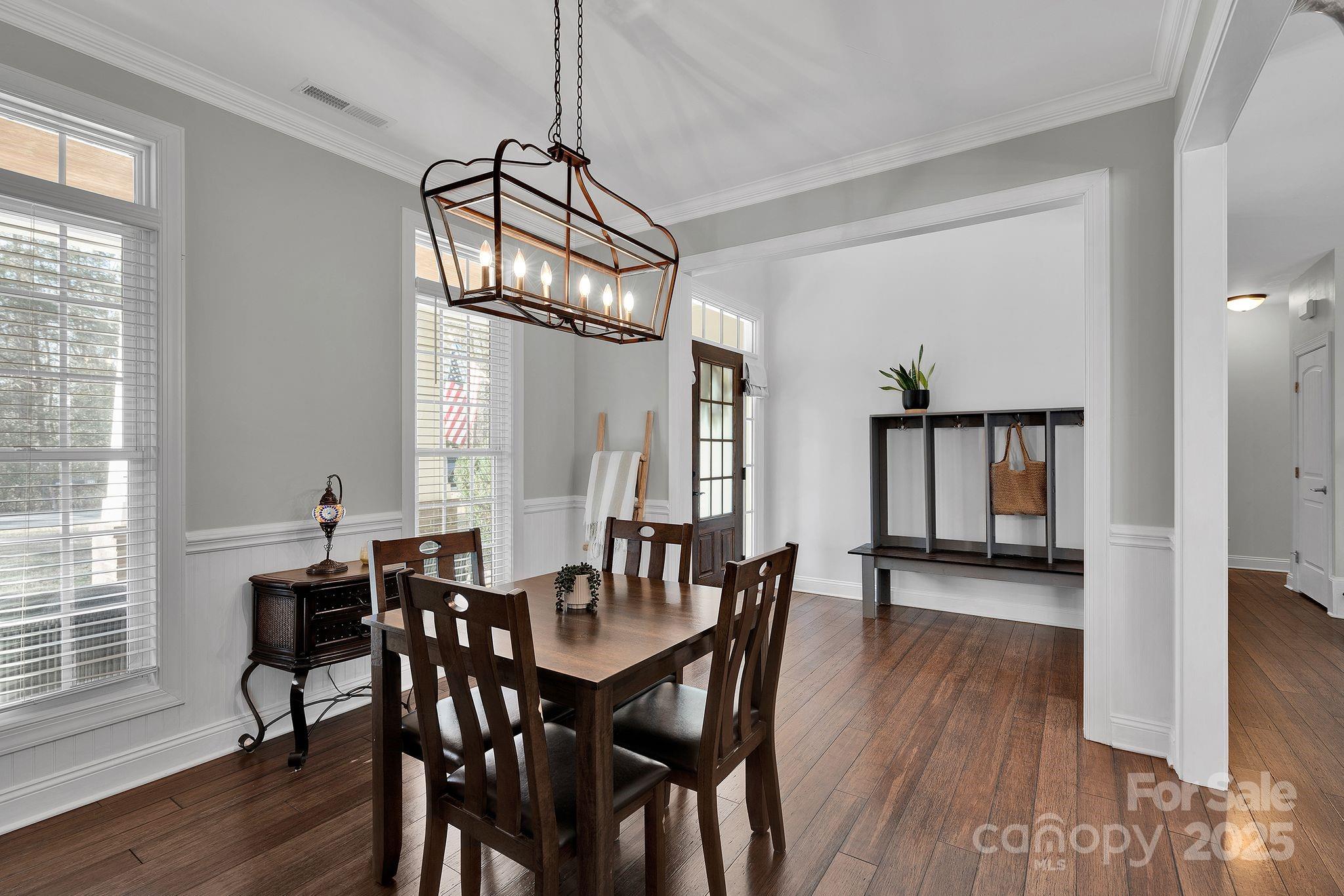 481 Evergreen Road Lake Wylie, SC 29710 - Photo 16 of 45 a view of a dining room with furniture window and wooden floor