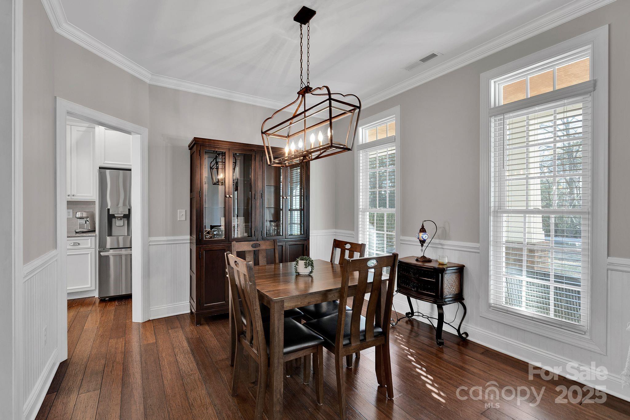 481 Evergreen Road Lake Wylie, SC 29710 - Photo 17 of 45 a view of a dining room with furniture window and wooden floor