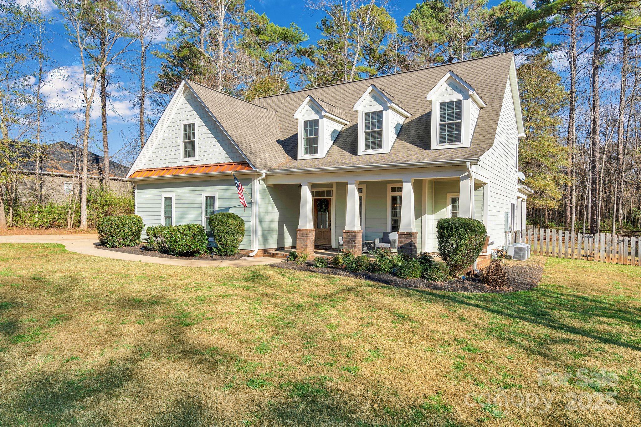 481 Evergreen Road Lake Wylie, SC 29710 - Photo 2 of 45 a front view of a house with yard and green space