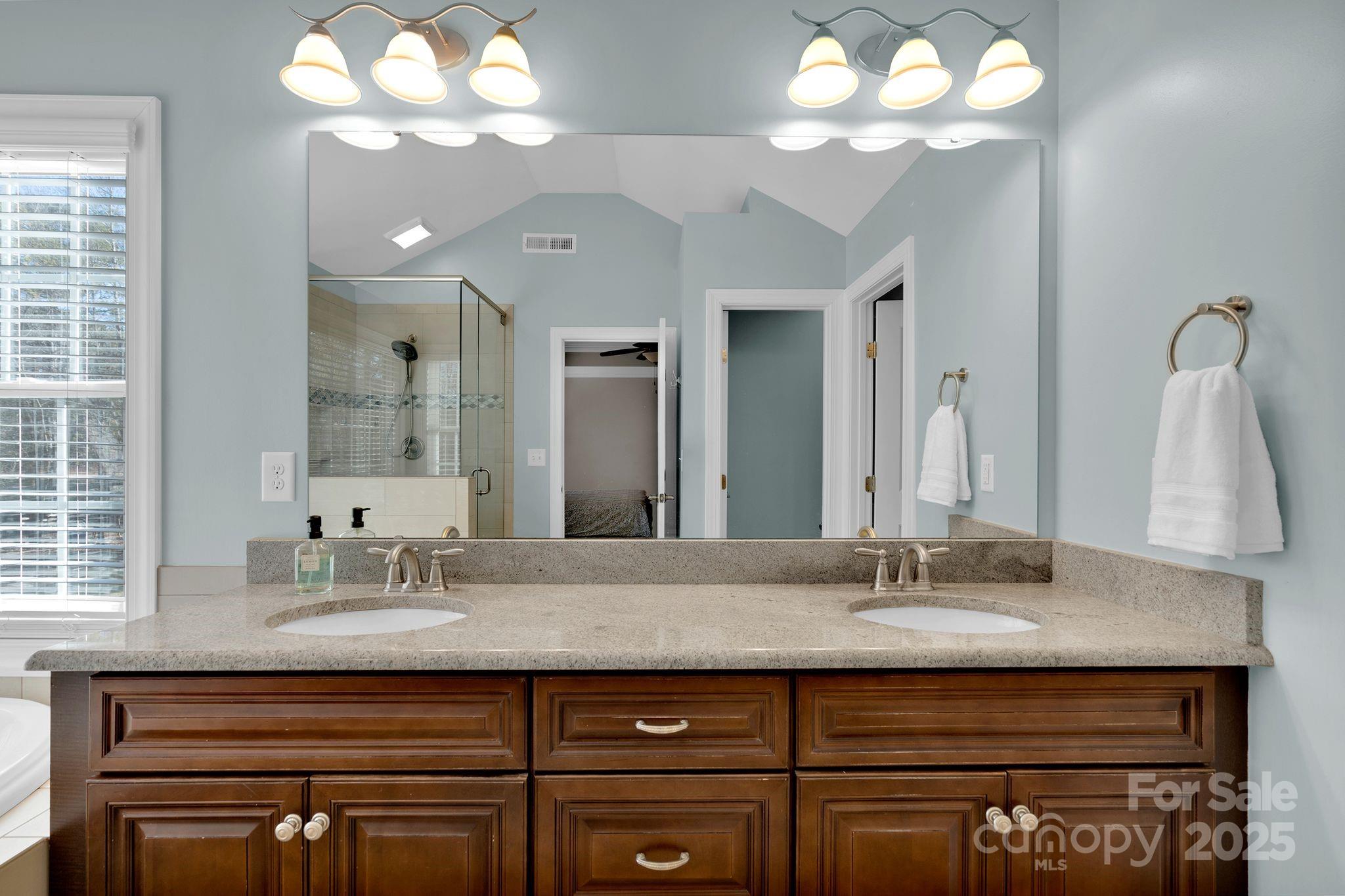 481 Evergreen Road Lake Wylie, SC 29710 - Photo 25 of 45 a bathroom with a sink double vanity and a mirror