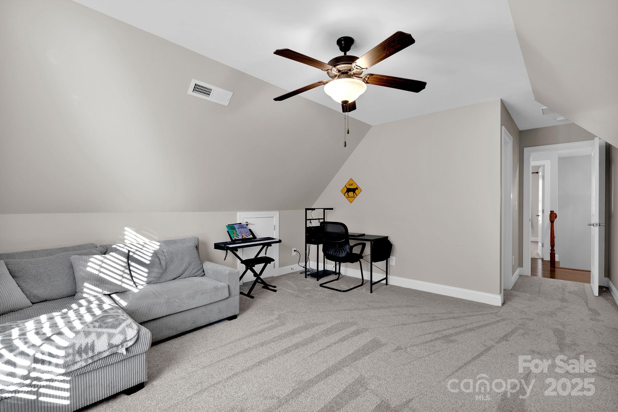 481 Evergreen Road Lake Wylie, SC 29710 - Photo 29 of 45 a living room with furniture and a ceiling fan