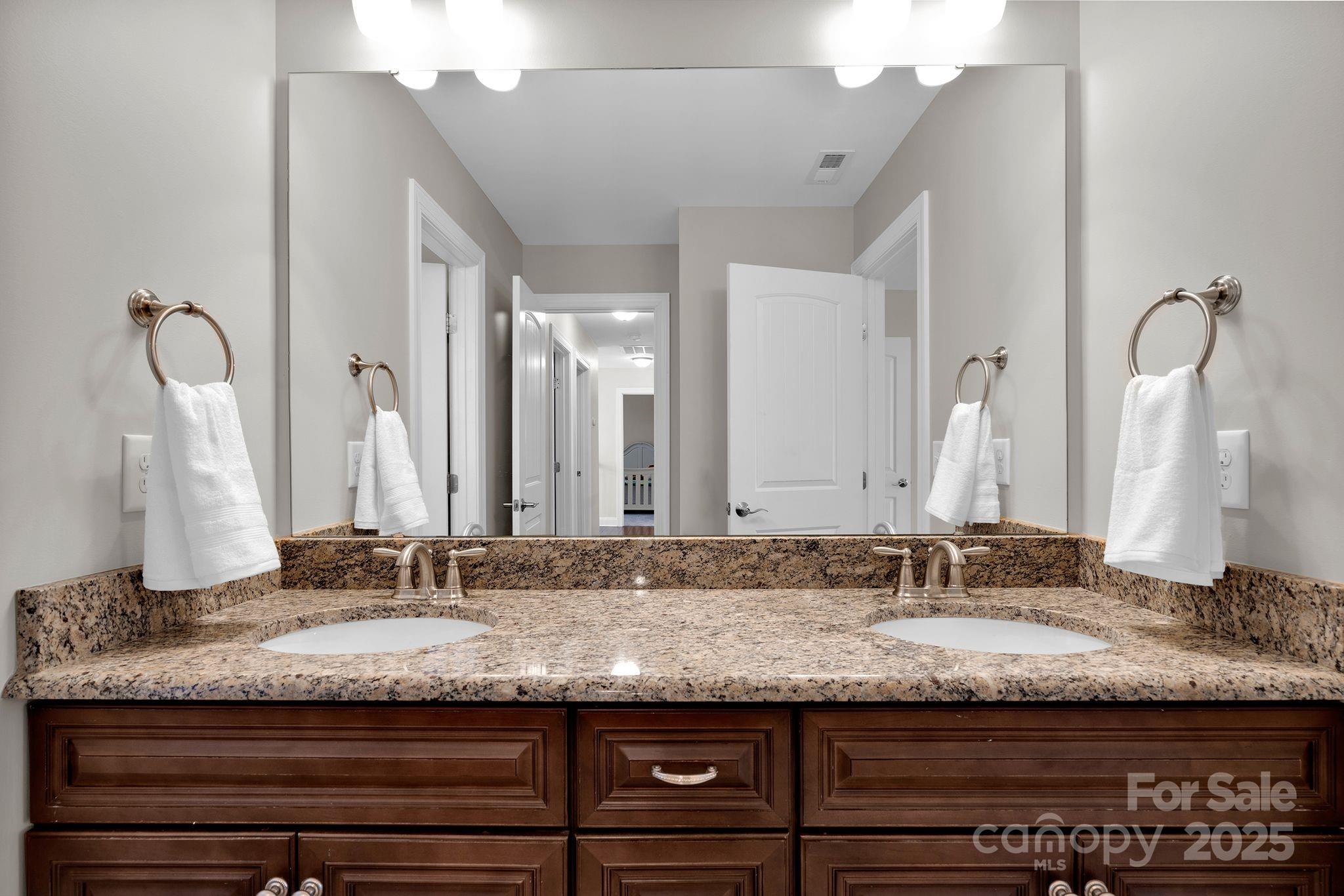 481 Evergreen Road Lake Wylie, SC 29710 - Photo 30 of 45 a bathroom with a granite countertop double vanity sink and a mirror