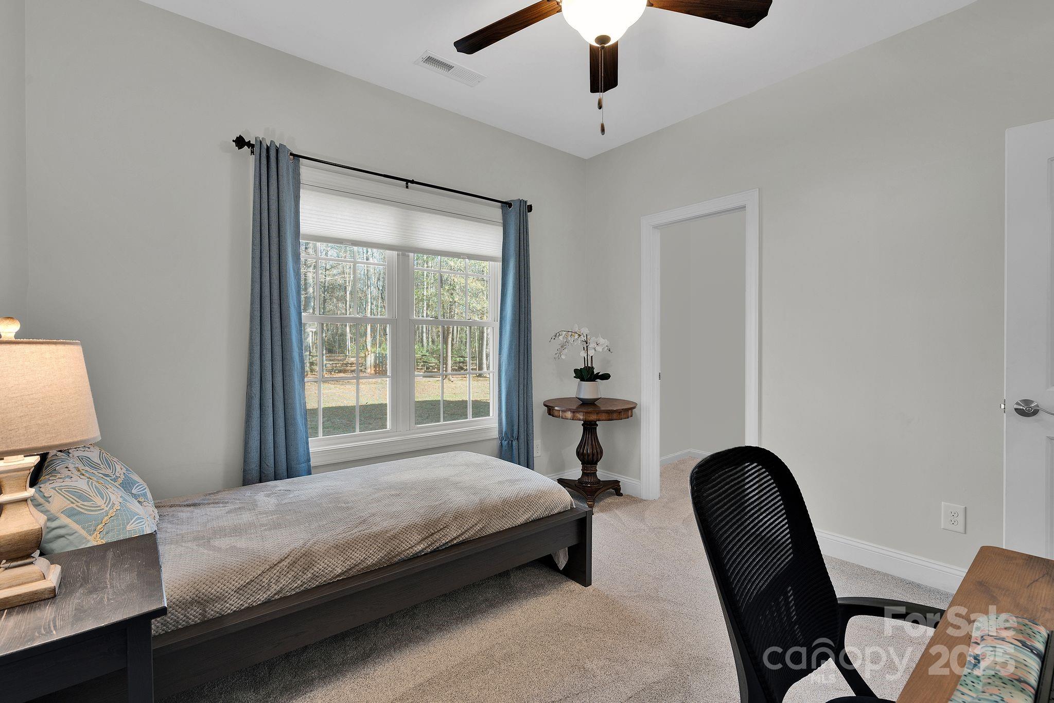 481 Evergreen Road Lake Wylie, SC 29710 - Photo 41 of 45 a bedroom with a bed and a chair