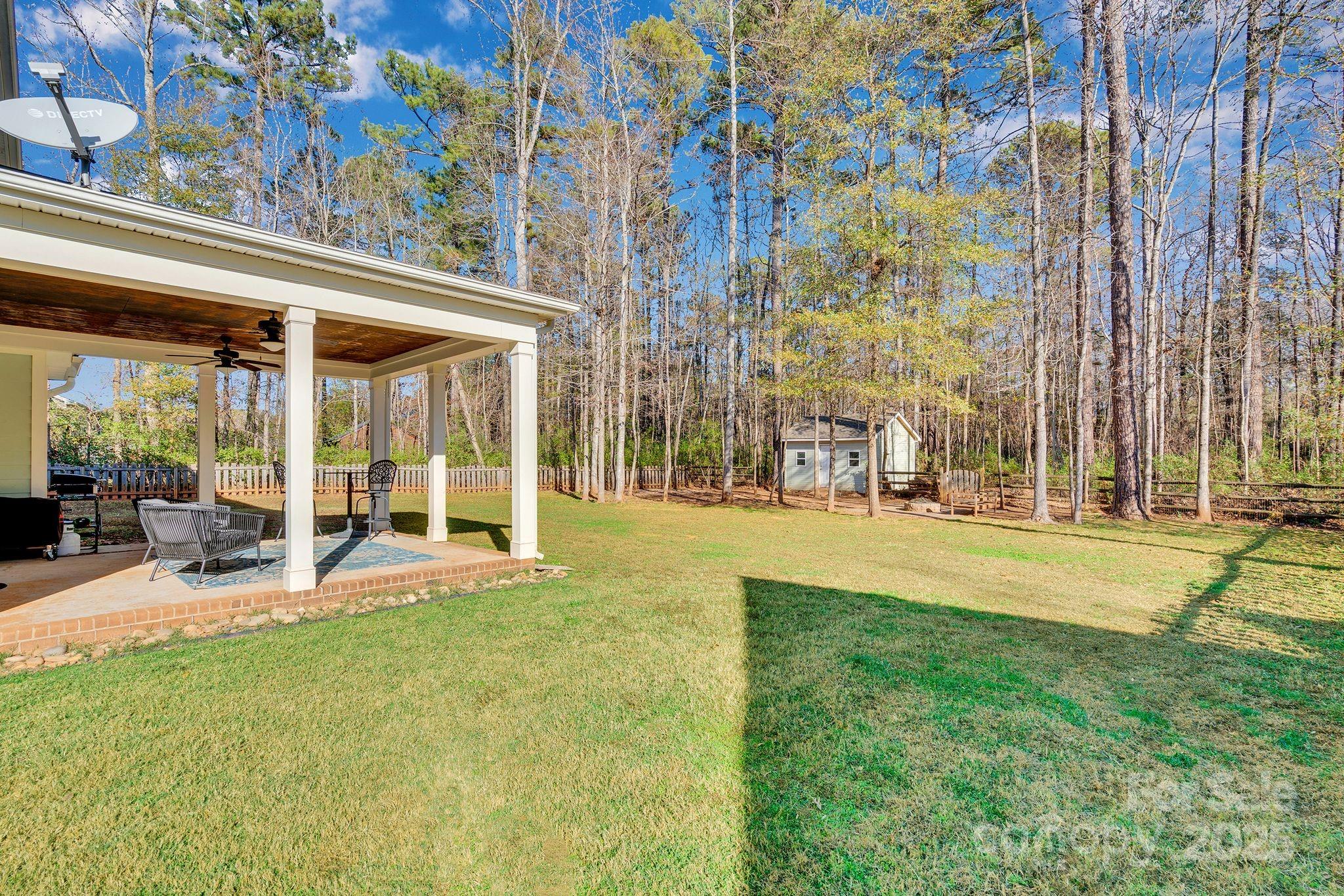 481 Evergreen Road Lake Wylie, SC 29710 - Photo 8 of 45 a view of swimming pool with outdoor seating and a garden