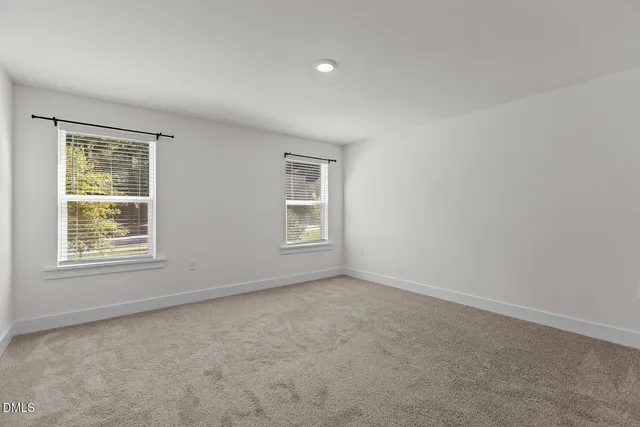 an empty room with wooden floor