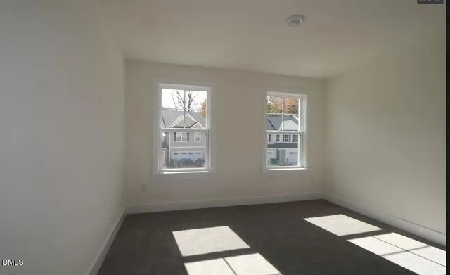 an empty room with closet area