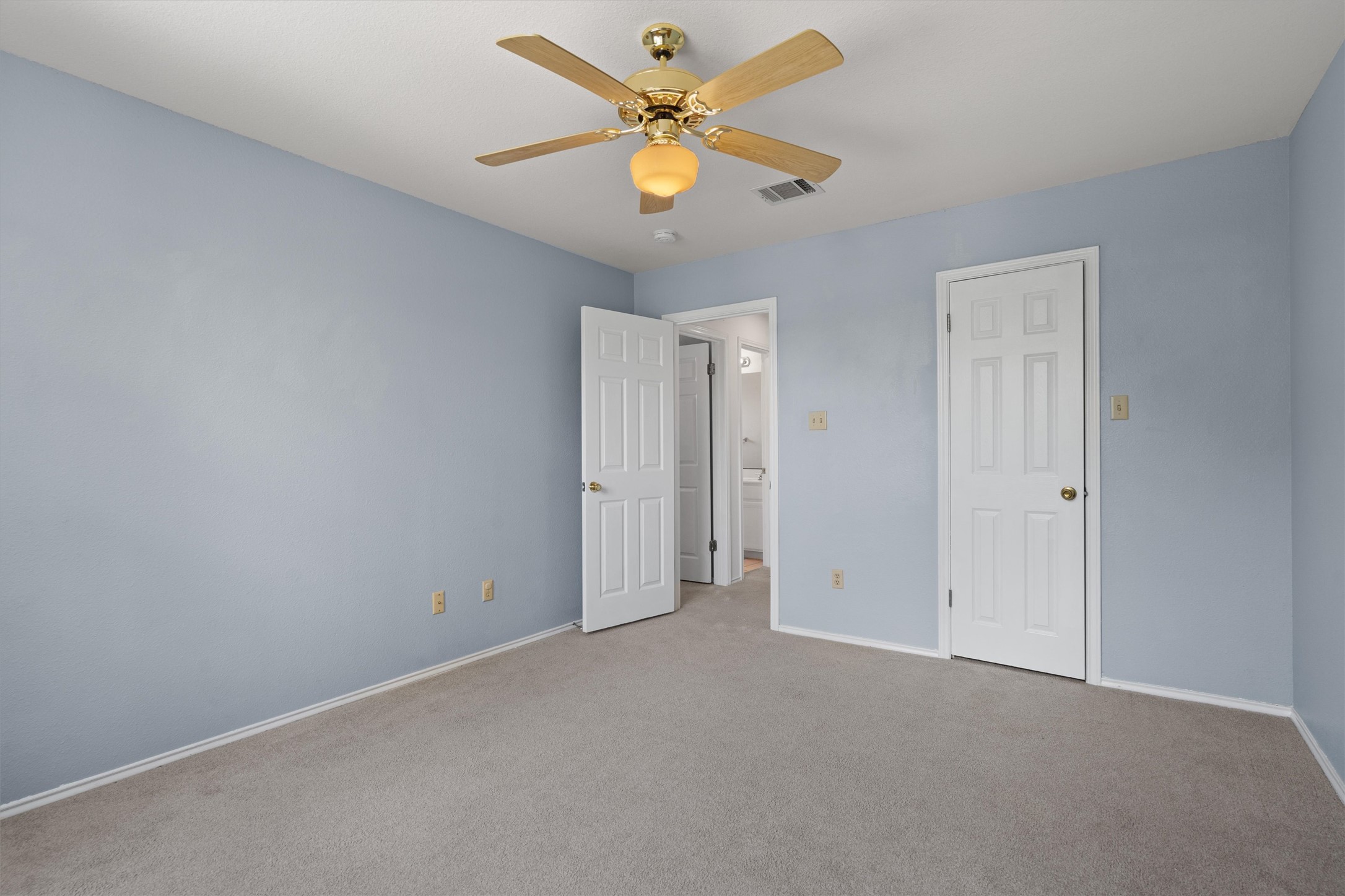 100 Parque Circle Georgetown, TX 78626 - Photo 25 of 39 an empty room with closet and a chandelier fan