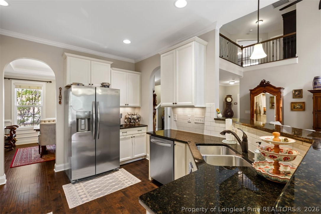 48 Valley Brook Lane Spring Lake, NC 28390 - Photo 15 of 50 a kitchen with stainless steel appliances granite countertop a refrigerator a stove and a sink with granite countertops