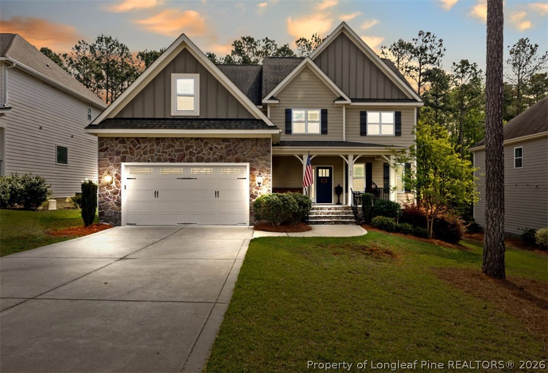 48 Valley Brook Lane Spring Lake, NC 28390 - Photo 2 of 50 a view of a white house with a big yard and potted plants