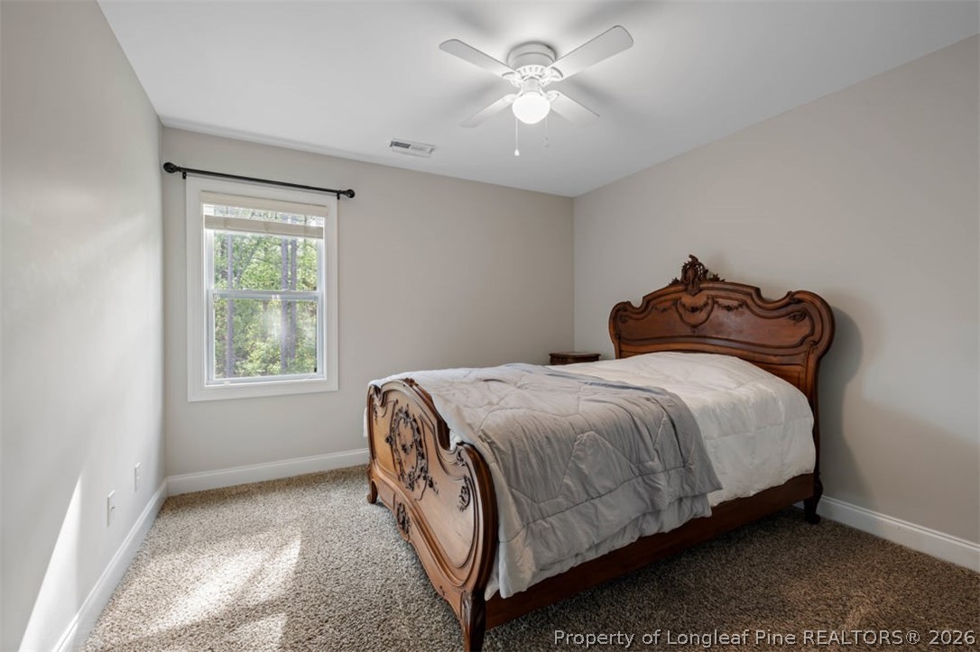 48 Valley Brook Lane Spring Lake, NC 28390 - Photo 26 of 50 a bedroom with a bed and a window