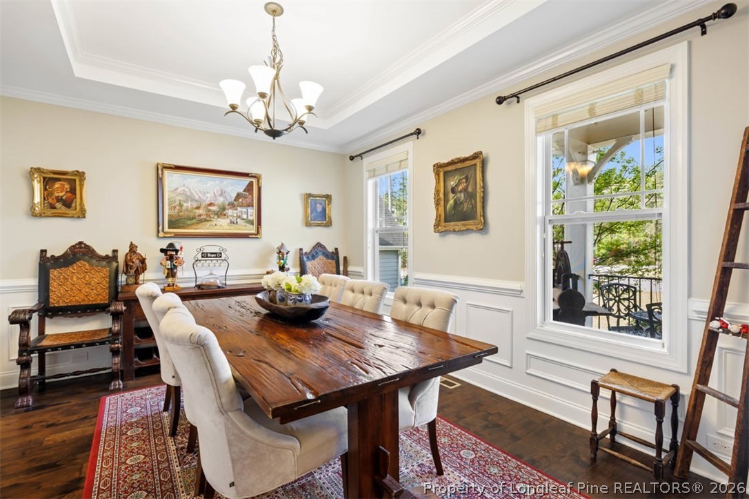 48 Valley Brook Lane Spring Lake, NC 28390 - Photo 4 of 50 a view of a dining room with furniture a chandelier and wooden floor