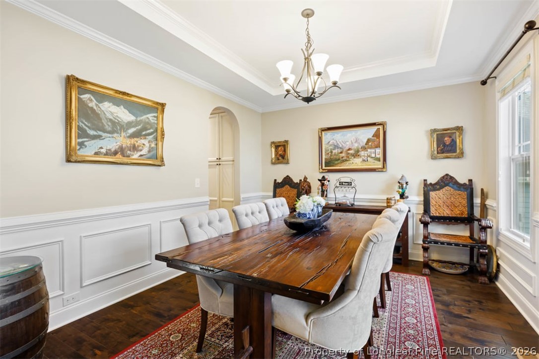 48 Valley Brook Lane Spring Lake, NC 28390 - Photo 5 of 50 a view of a dining room with furniture a rug and wooden floor
