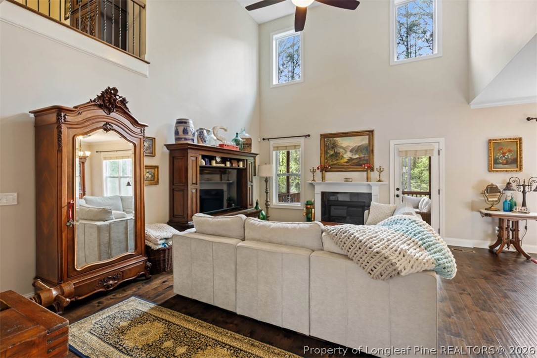 48 Valley Brook Lane Spring Lake, NC 28390 - Photo 6 of 50 a living room with furniture a fireplace and a flat screen tv